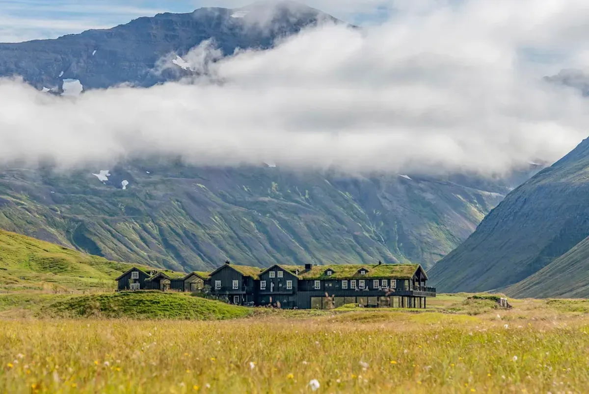 Isolated farmstead in misty Icelandic valley