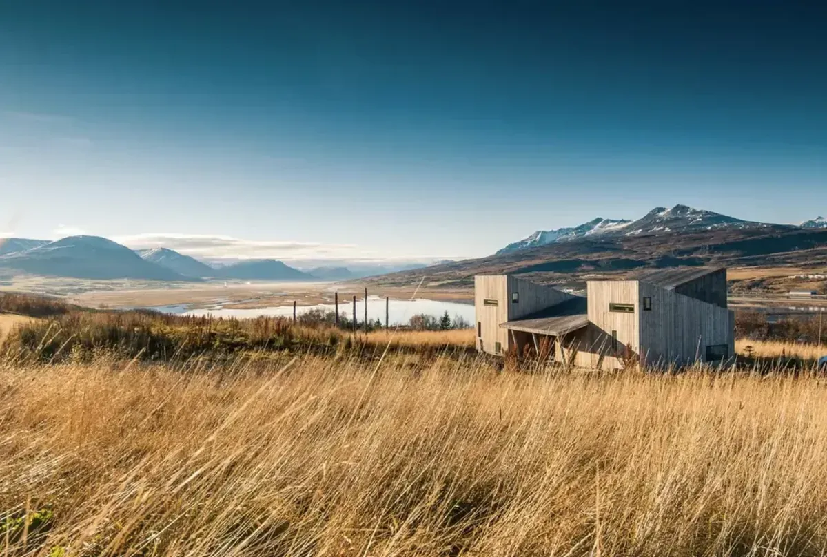 Modern cabin in windswept Icelandic landscape